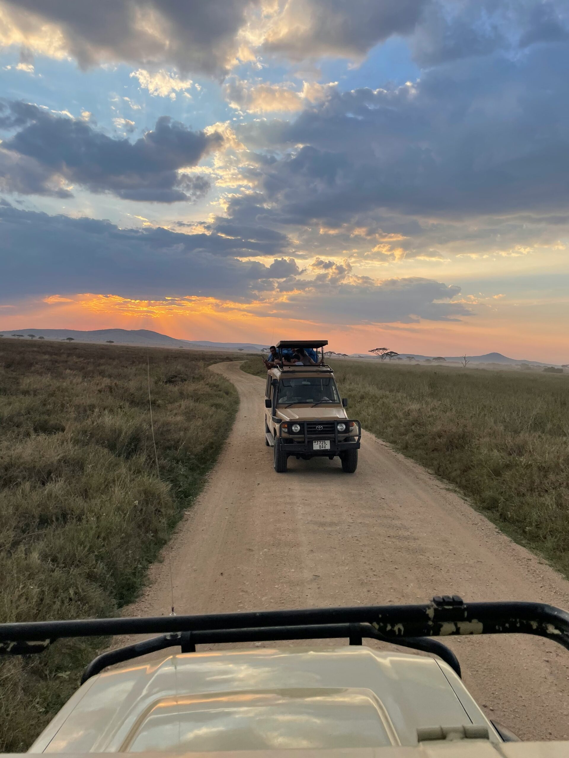 Safari vehicle at sunset in Serengeti National Park, Tanzania