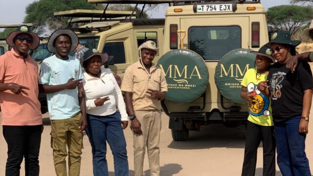 Mwisho wa Mwezi Adventures team with safari vehicles, Tanzania