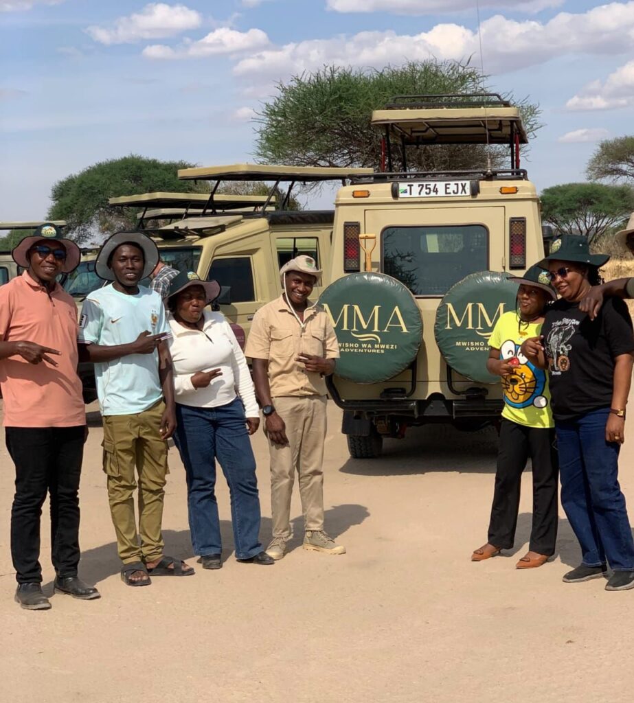 Mwisho wa Mwezi Adventures team with safari vehicles, Tanzania